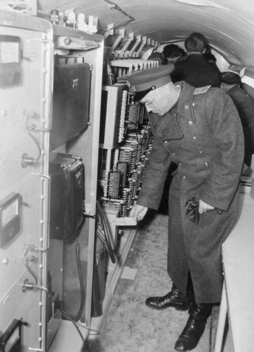 Historical Bundesarchiv photograph of a Soviet officer in the espionage tunnel at Altglienicke, after the tunnel’s discovery.