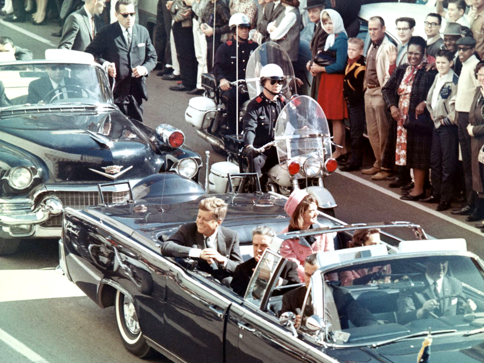 President Kennedy in his limousine on Main Street in Dallas, minutes before the assassination.