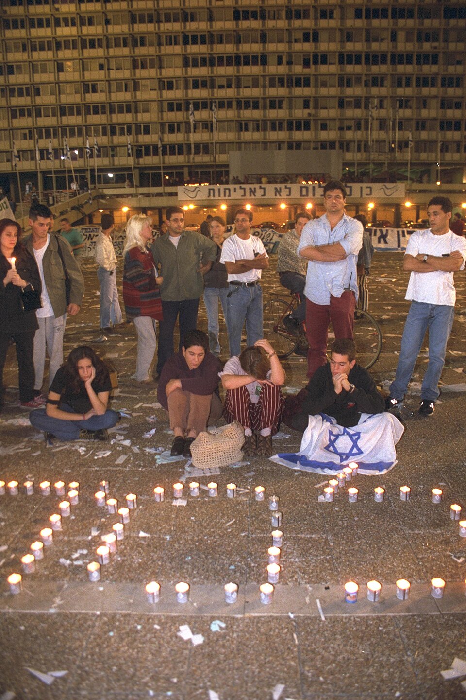 Teenagers lighting memorial candles in Tel Aviv after hearing of Rabin’s assassination.