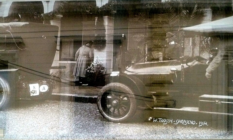 An exhibited historical image of the assassination outside the Austria Hotel in Ilidža.