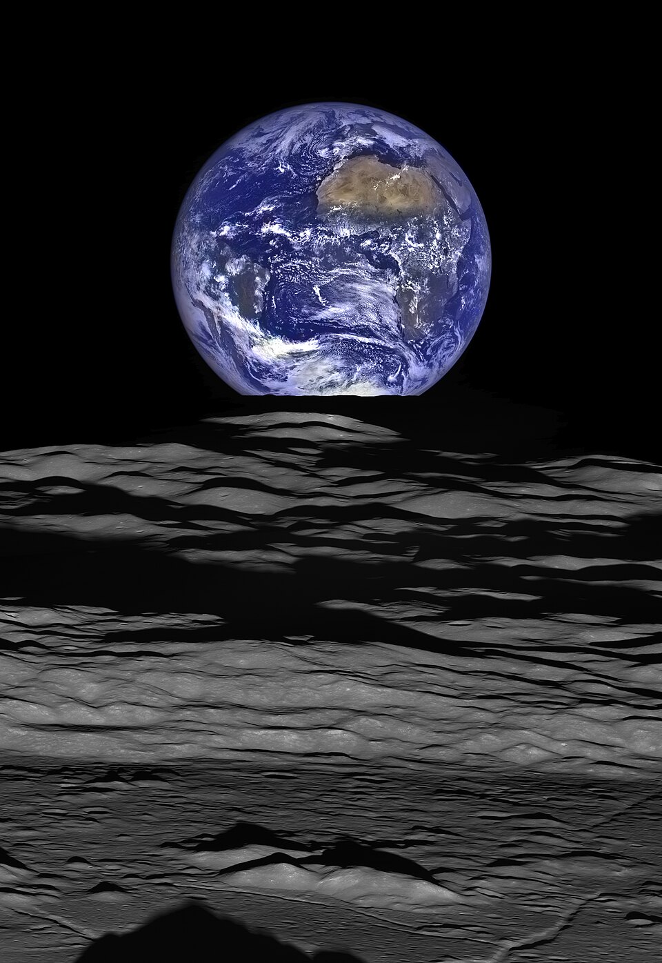 Earth above the lunar horizon in a Lunar Reconnaissance Orbiter view over Compton crater.