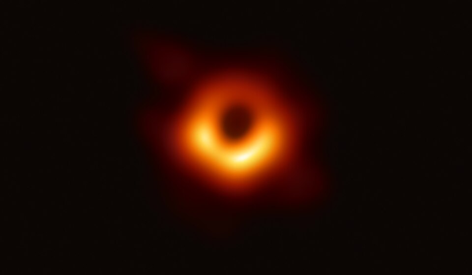 Event Horizon Telescope radio image of M87, showing a bright ring around a dark central shadow.