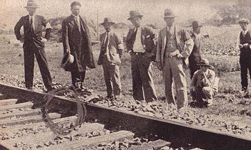 Japanese experts inspecting a railway scene in 1931